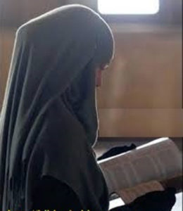 Muslim woman reads the Word